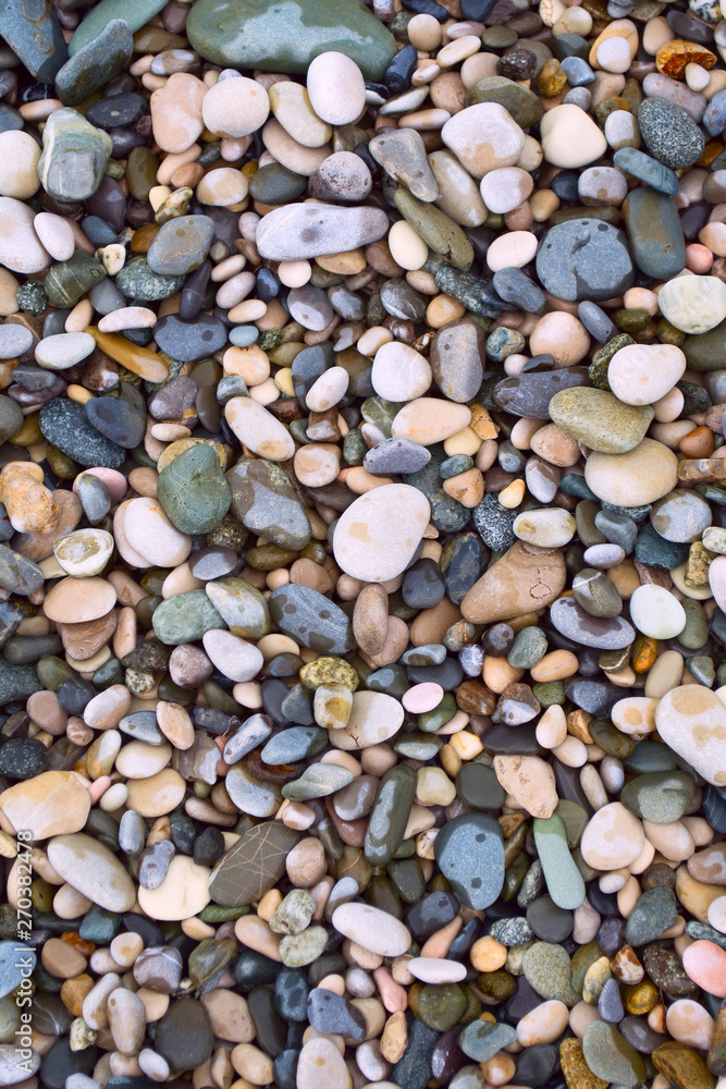 Fototapeta premium Sea stone texture. Sea wallpaper with pebbles from the coast. 