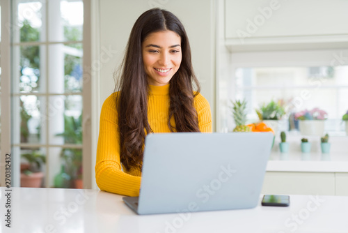 Photography Beauitul young woman working using computer laptop concentrated and smiling