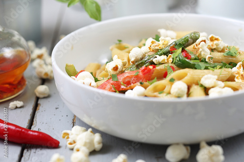 Penne  pasta with asparagus, smoked tofu, chilli peppers and mini corn onions in nut sauce