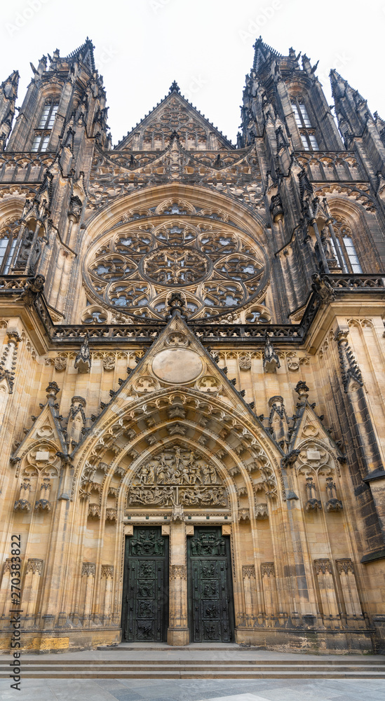 Prague, Czech Republic. St. Vitus Cathedral and Gothic style of West entrance bronze doors, decorated with reliefs with scenes from history of the Cathedral and legends about St. Wenceslas and Adalber