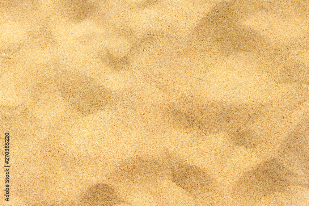 closeup of sand pattern of a beach in the summer closeup of sand pattern of a beach in the summer