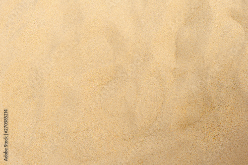 closeup of sand pattern of a beach in the summer 