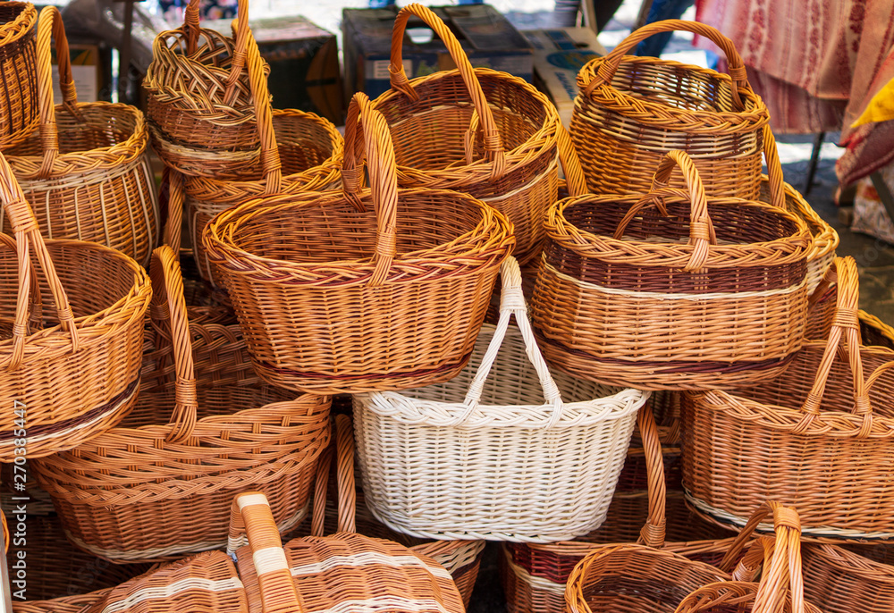 Picnic baskets on the street in stacks for sale. Picnic baskets on the street in stacks for sale.