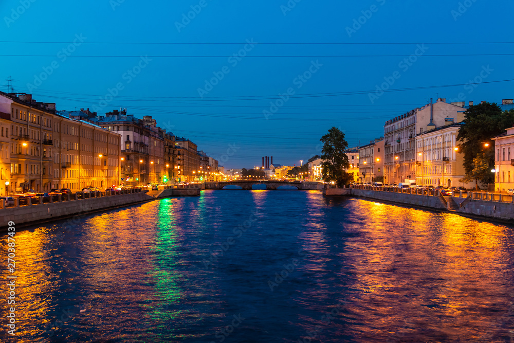 Beautiful night view of the Fontanka River and historic buildings from the Krasnoarmeyskiy bridge, Saint Petersburg, Russia
