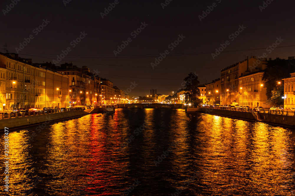 Beautiful night view of the Fontanka River and historic buildings from the Krasnoarmeyskiy bridge, Saint Petersburg, Russia