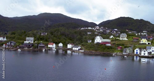 Wallpaper Mural Aerial drone pull-in shot of a small town with houses, boat houses and docked boats in the Fjords of Norway Torontodigital.ca