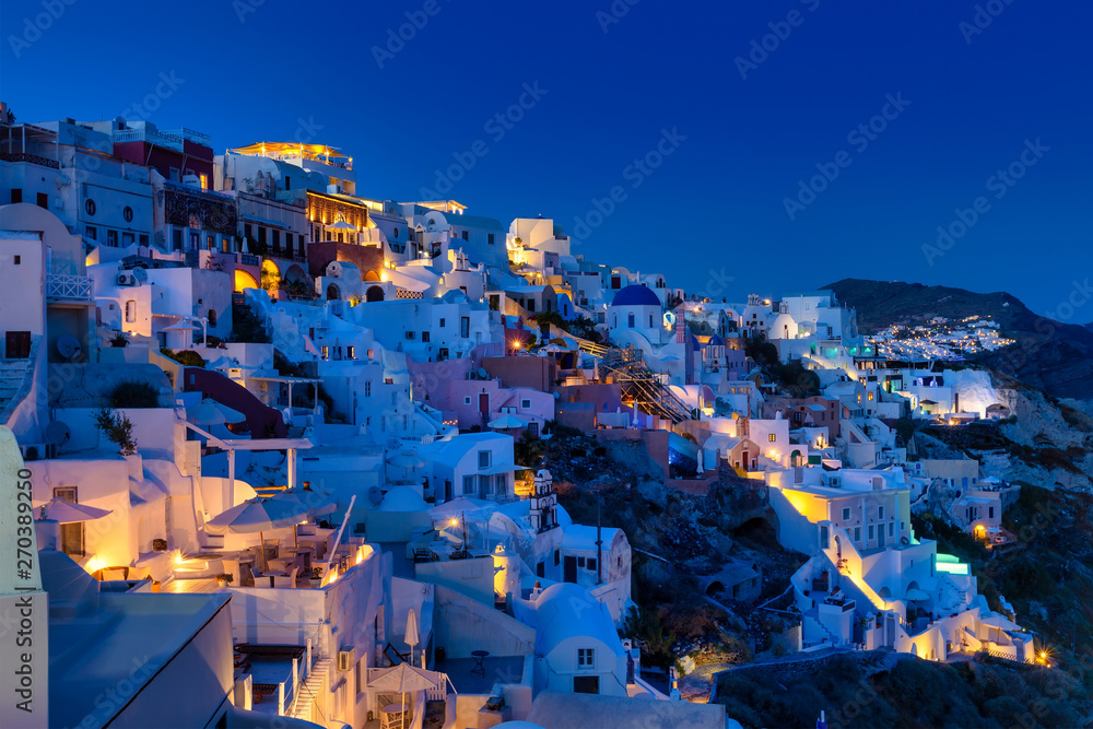 Oia village in Santorini island at sunset in Greece
