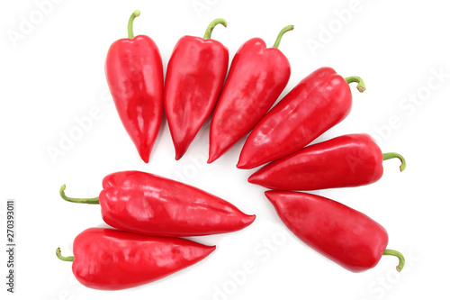 eight bright red sweet peppers on a white background