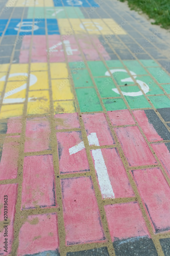 Colorful children game hopscotch on pavement