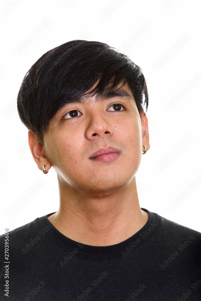 Obraz premium Face of cool handsome Asian man thinking