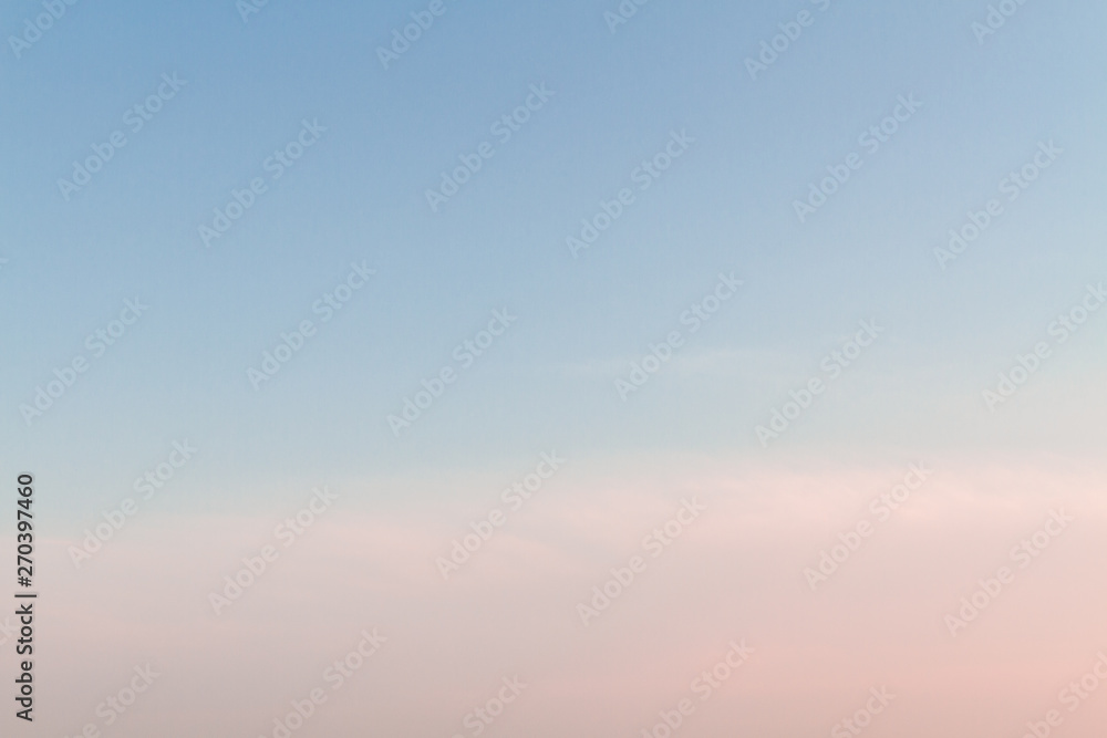 Beautiful sunset sky with feathery pink clouds in spring