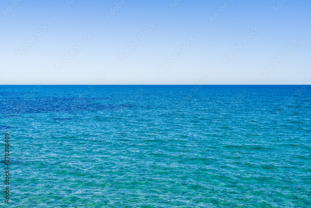 Amazing beautiful blue ocean and rocks on a sunny day, natural outdoor landscape by the beach