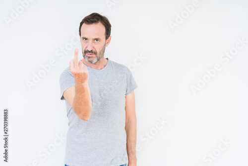 Handsome senior man over isolated background Showing middle finger, impolite and rude fuck off expression