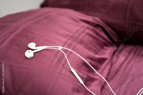 earphone on the bed in the room