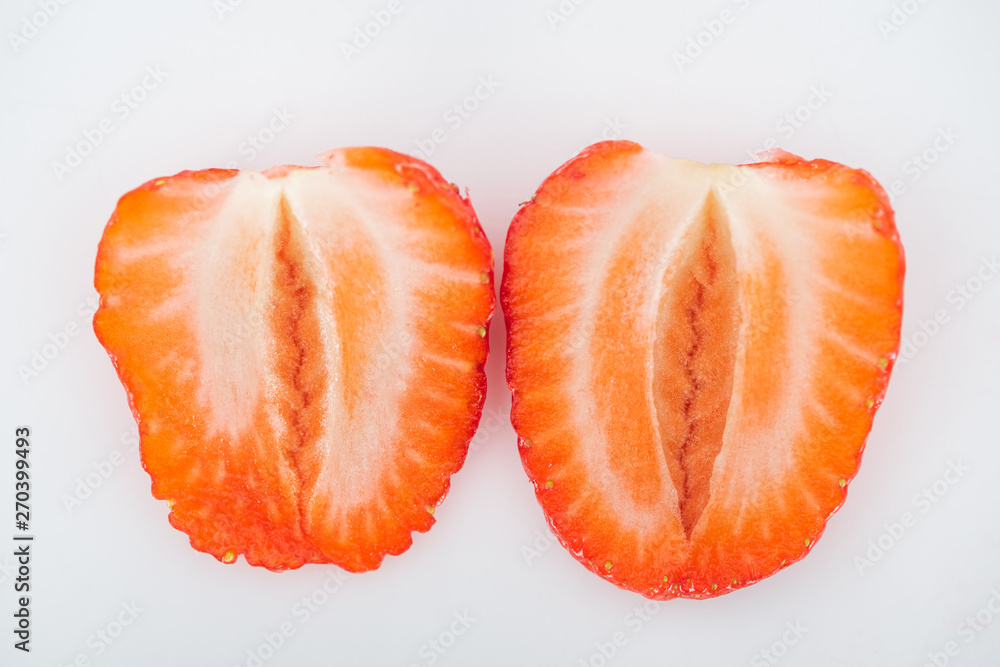 close up view of fresh ripe red strawberry halves on white background close up view of fresh ripe red strawberry halves on white background