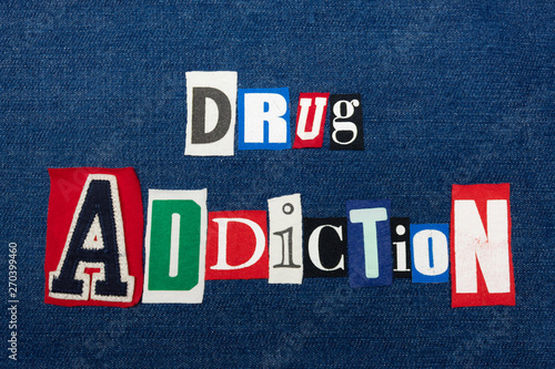 DRUG ADDICTION text word collage, colorful fabric on blue denim, abuse and treatment concept, horizontal aspect