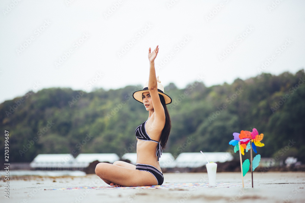 sexy beautiful asian woman on beach summer vacation in bikini sitting on sand in holiday. - obrazy, fototapety, plakaty 