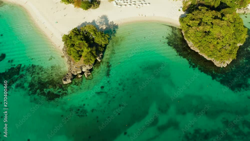 Tropical white sand beach in a lagoon with turquoise water on Boracay Island, Philippines., aerial view. Seascape with beach on tropical island. Summer and travel vacation concept. Tropical white sand beach in a lagoon with turquoise water on Boracay Island, Philippines., aerial view. Seascape with beach on tropical island. Summer and travel vacation concept.