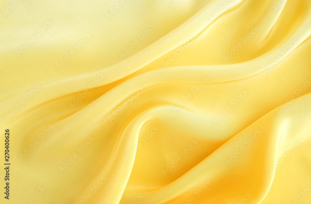 Fototapeta premium silk fabric texture, background pastel yellow color . copy space