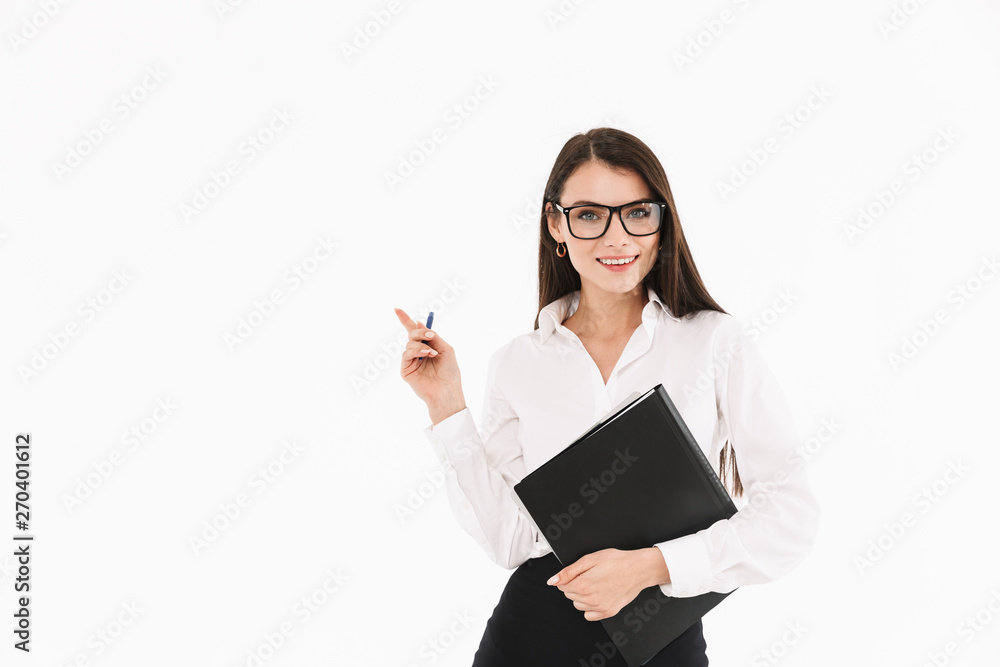 Photo of joyful female worker businesswoman dressed in formal wear holding bookbinder with documents while working in office Photo of joyful female worker businesswoman dressed in formal wear holding bookbinder with documents while working in office
