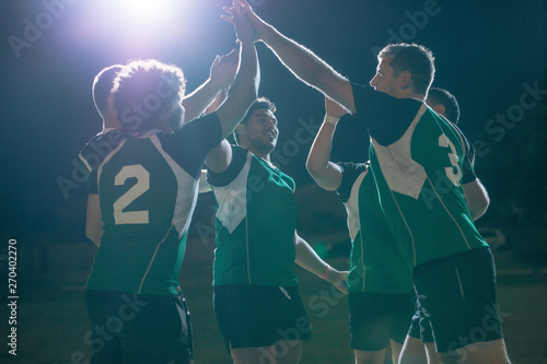 Fototapeta Naklejka Na Ścianę i Meble -  Rugby players celebrating championship win