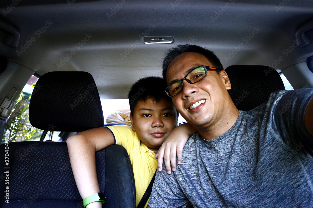 Filipino family inside a car Filipino family inside a car