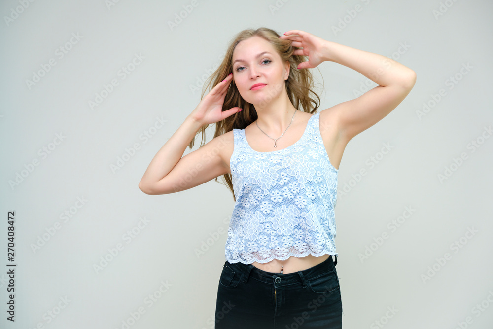 Life is beautiful and I like everything here. I am satisfied with life and I wish you. Portrait of a smiling beautiful blonde girl on a gray background in various poses. Life is beautiful and I like everything here. I am satisfied with life and I wish you. Portrait of a smiling beautiful blonde girl on a gray background in various poses.