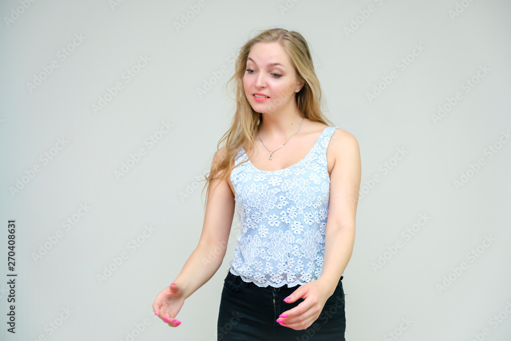 Life is beautiful and I like everything here. I am satisfied with life and I wish you. Portrait of a smiling beautiful blonde girl on a gray background in various poses. Life is beautiful and I like everything here. I am satisfied with life and I wish you. Portrait of a smiling beautiful blonde girl on a gray background in various poses.