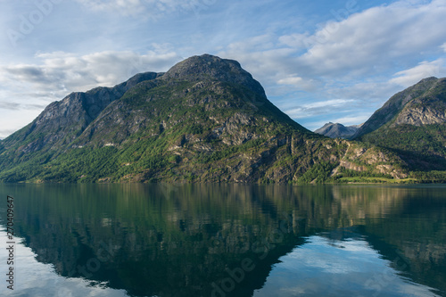 Mountain reflected in the water of a lake. Oppstrynsvatnet lake in Oppstryn, Norway.