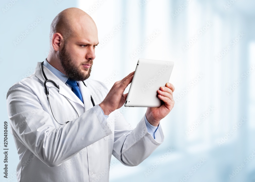 Close-up Doctor at hospital working with tablet pc Close-up Doctor at hospital working with tablet pc