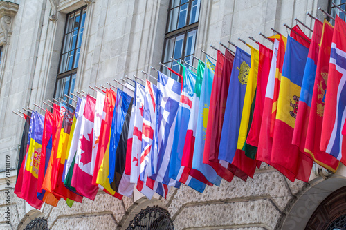Flags of almost all countries of the northern hemisphere on the facade the building of Hofburg palace in Vienna, Austria. photo