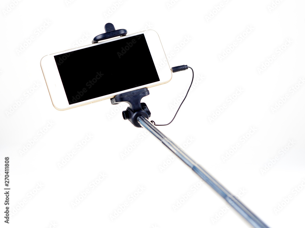 Selfie stick with mobile phone on the white background Selfie stick with mobile phone on the white background