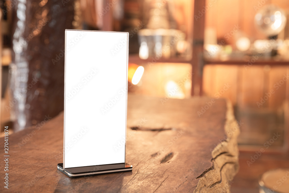 Menu frame standing on wood table in coffee shop. space for text marketing promotion Menu frame standing on wood table in coffee shop. space for text marketing promotion