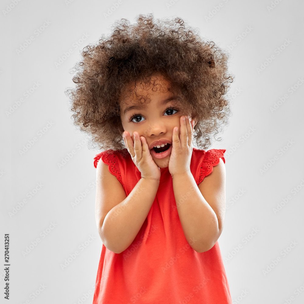 childhood and people concept - surprised or scared little african american girl with open mouth over grey background - obrazy, fototapety, plakaty 