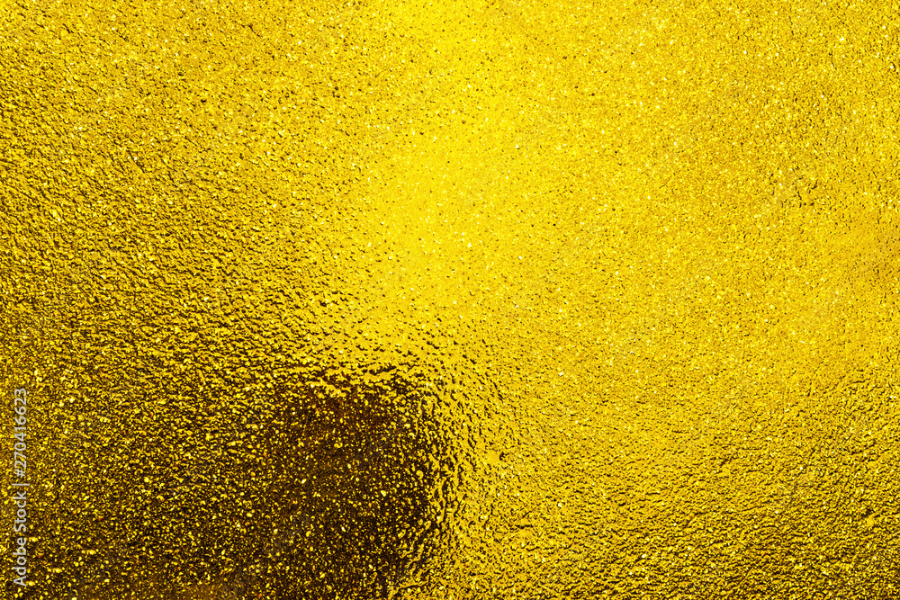 Wet asphalt tinted yellow. Abstract background. Wet asphalt tinted yellow. Abstract background.