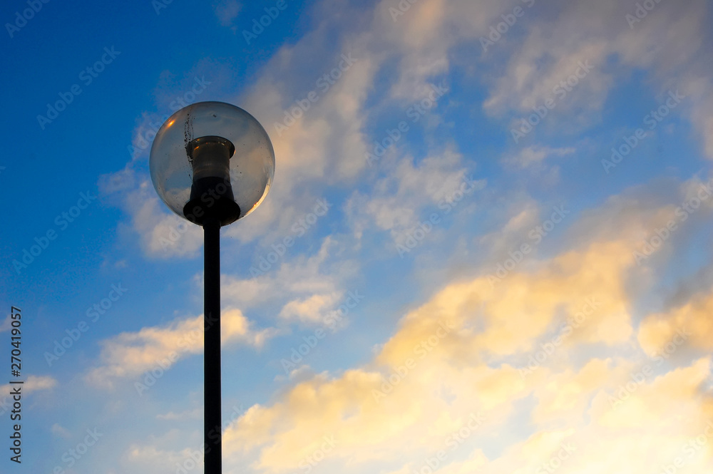 Spherical street lamp against a sunset sky. Spherical street lamp against a sunset sky.