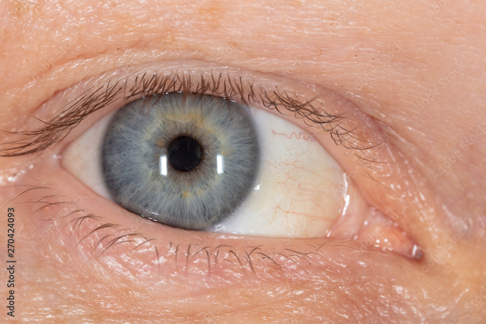 Blue eye on the man's face. Macro Blue eye on the man's face. Macro