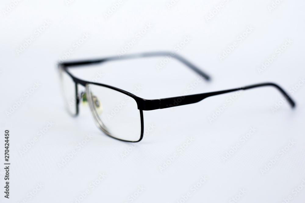 glasses for the visually impaired, poorly sighted.glasses with aspherical astigmatic lenses in black frame on a white background. glasses for the visually impaired, poorly sighted.glasses with aspherical astigmatic lenses in black frame on a white background.