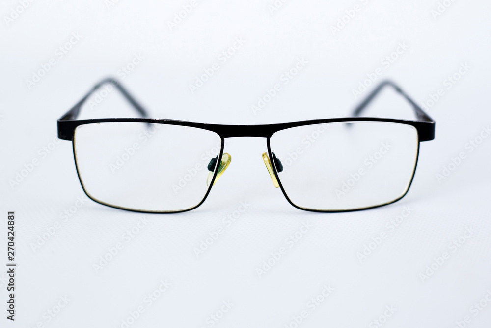 glasses for the visually impaired, poorly sighted.glasses with aspherical astigmatic lenses  in black frame on a white background.