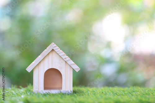 Wallpaper Mural Business investment and real estate, Model house on natural green background Torontodigital.ca