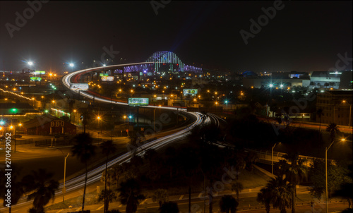 Streaked lights Of Cars at Night Crossing Bridge