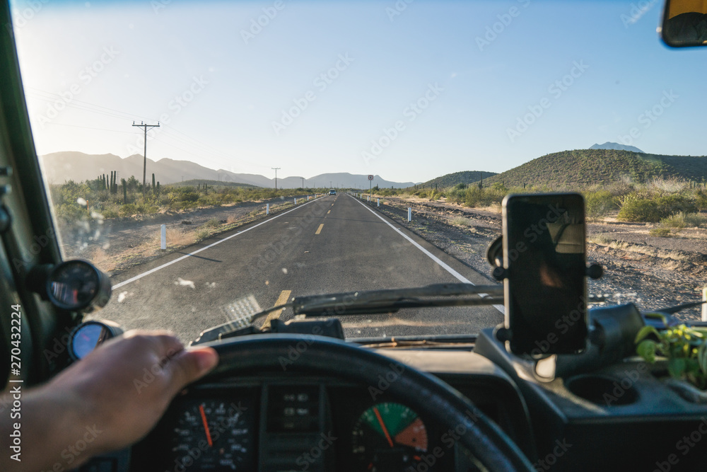 POV driving an rv with a gps on the glass through Arizona