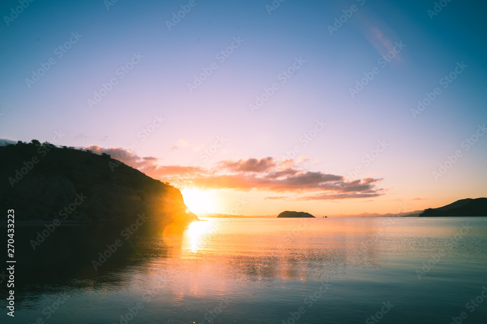Fototapeta premium Beautiful sunset with reflections in the water in the californian coast.