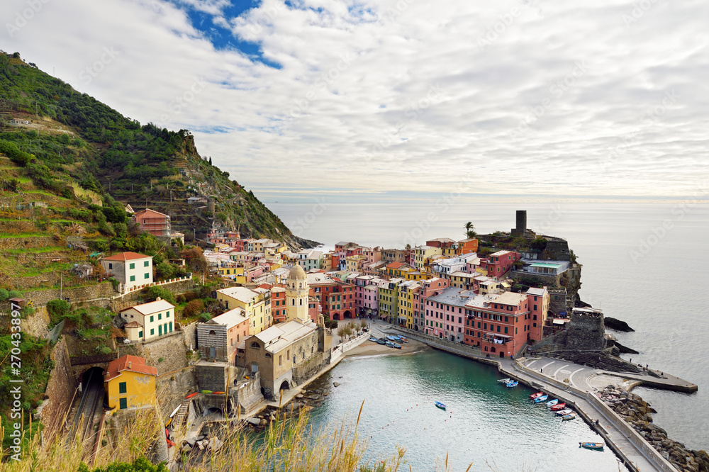 Colourful houses and small marina of Vernazza, one of the five centuries-old villages of Cinque Terre, located on rugged northwest coast of Italian Riviera.
