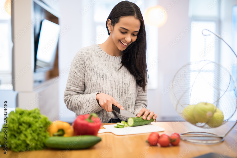 Young woman cooking. Healthy food vegetable salad. Diet. Dieting concept. Healthy lifestyle. Cooking at home. Prepare food Young woman cooking. Healthy food vegetable salad. Diet. Dieting concept. Healthy lifestyle. Cooking at home. Prepare food