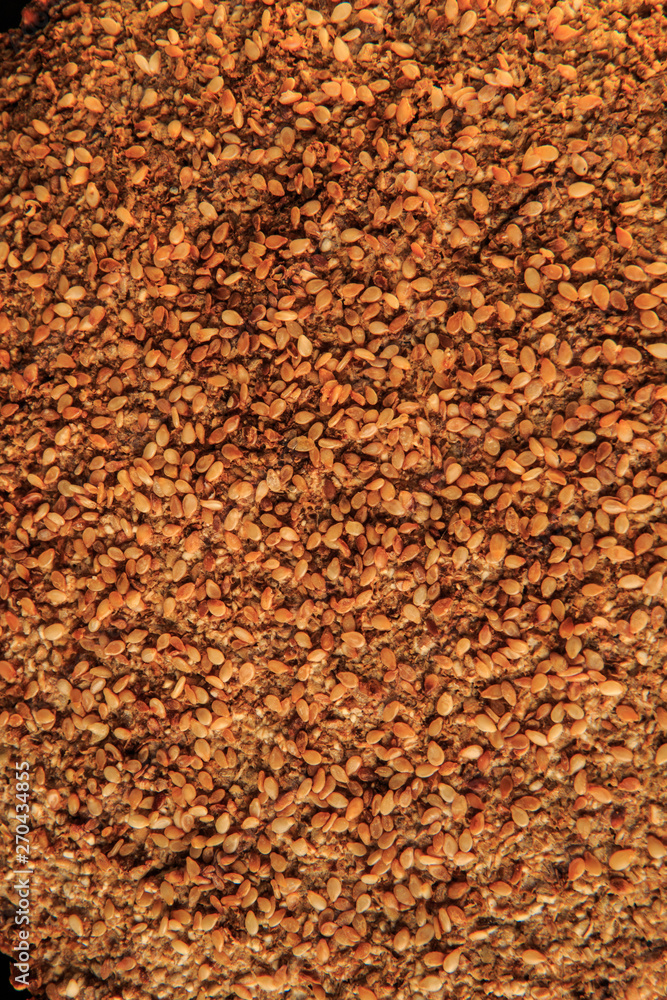 macro view surface of homemade whole rye bread with sesame seeds macro view surface of homemade whole rye bread with sesame seeds
