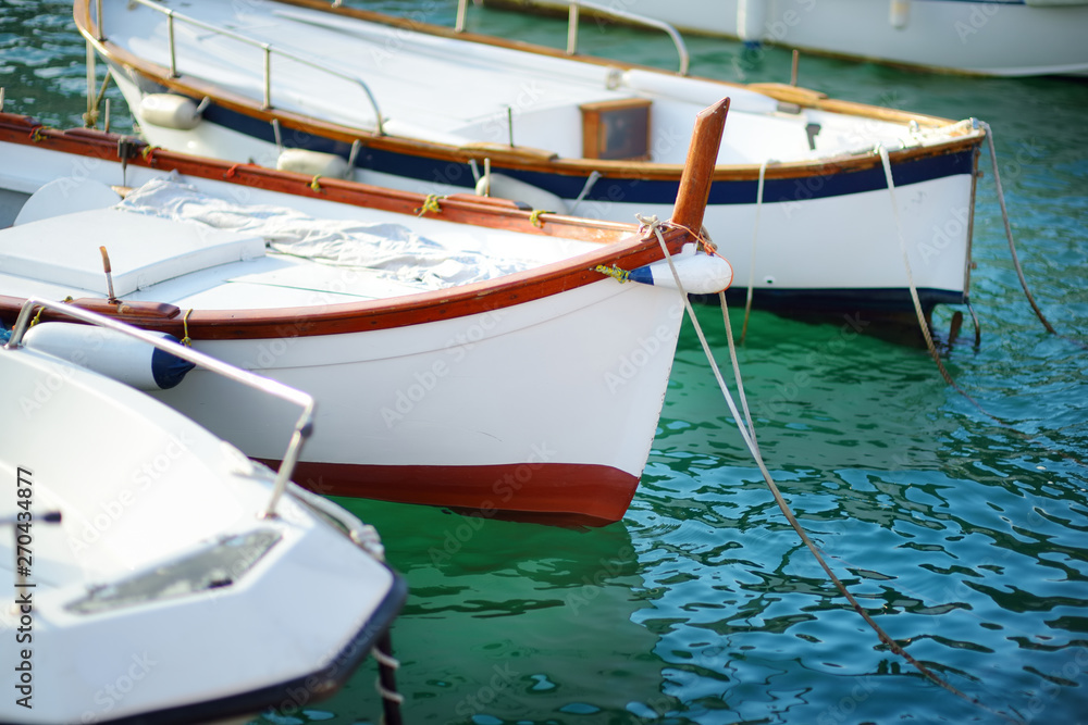Small yachts and fishing boats in marina of Porto Venere town, a part of the Italian Riviera, Italy.
