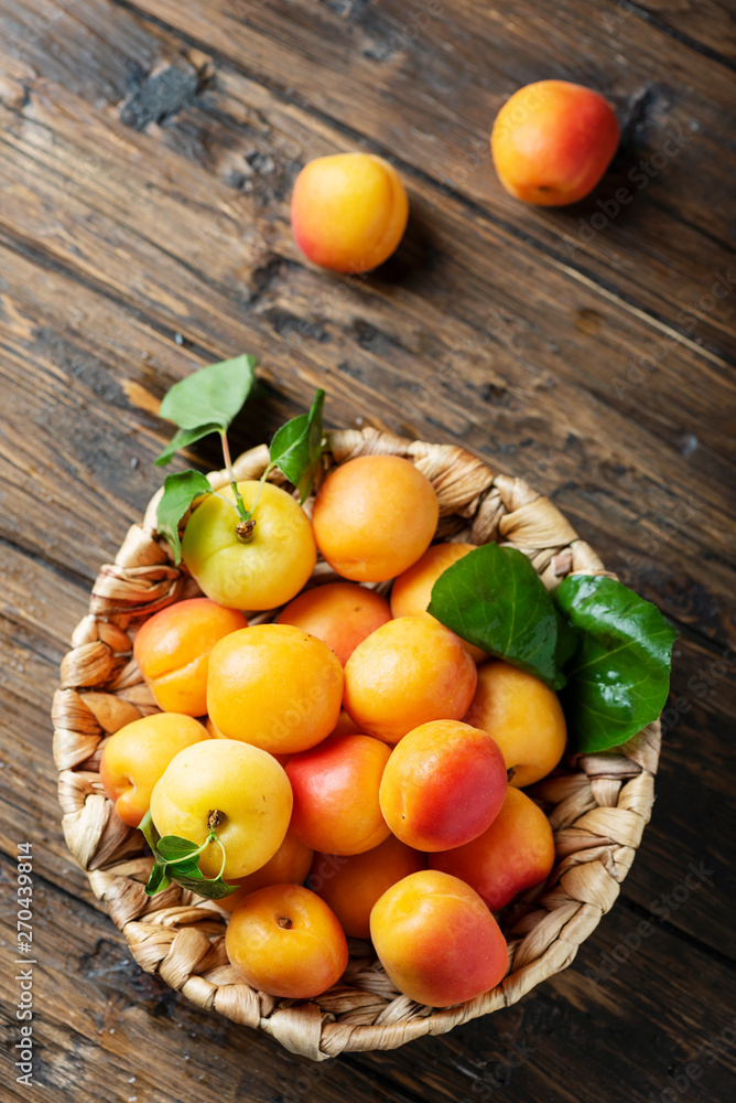 Sweet apricots on the wooden table