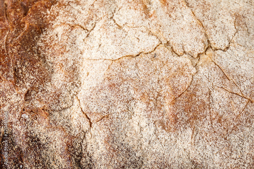 Closeup of tasty rye bread as background, top view
