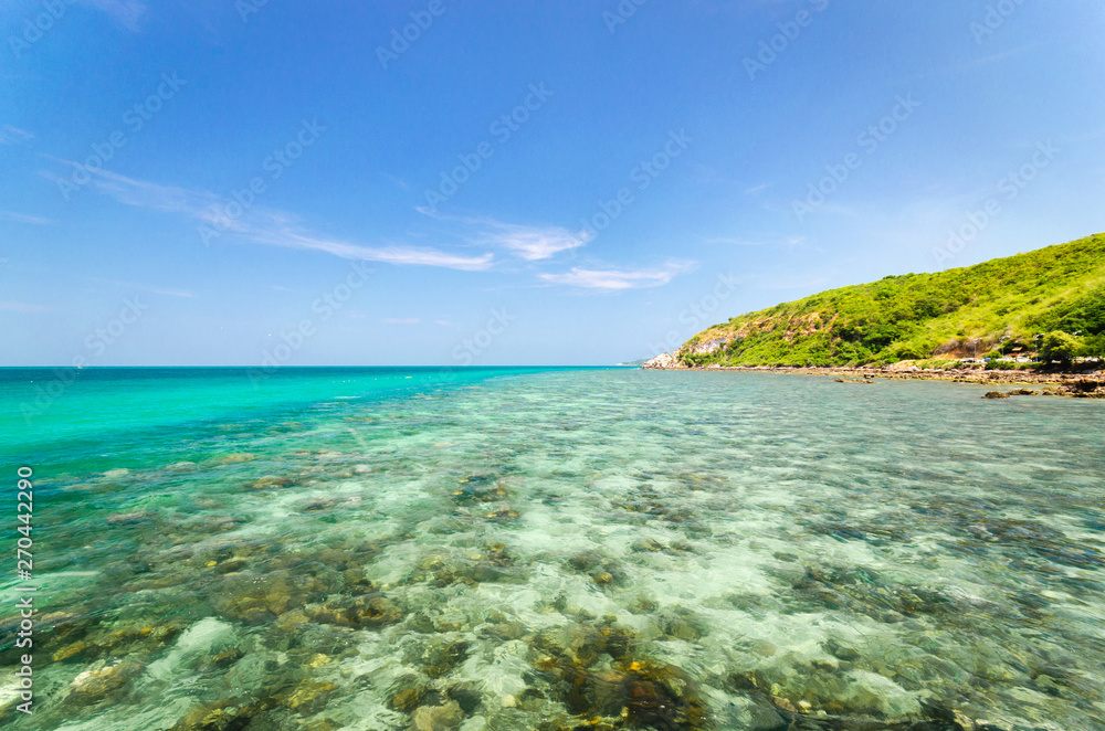 beautiful the beach closeup smooth sand and clear blue sea water. vacation background on summer in Thailand coast.